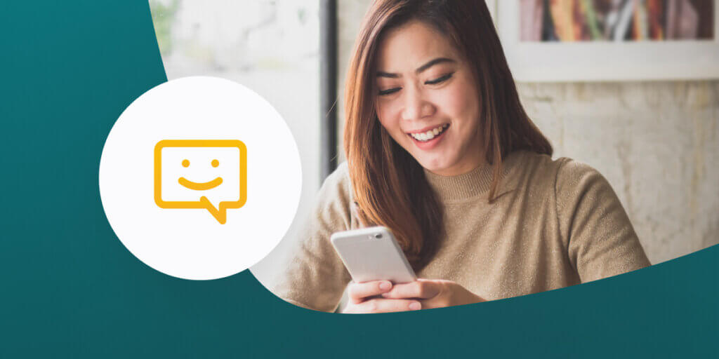 Woman using mobile phone to send text message.