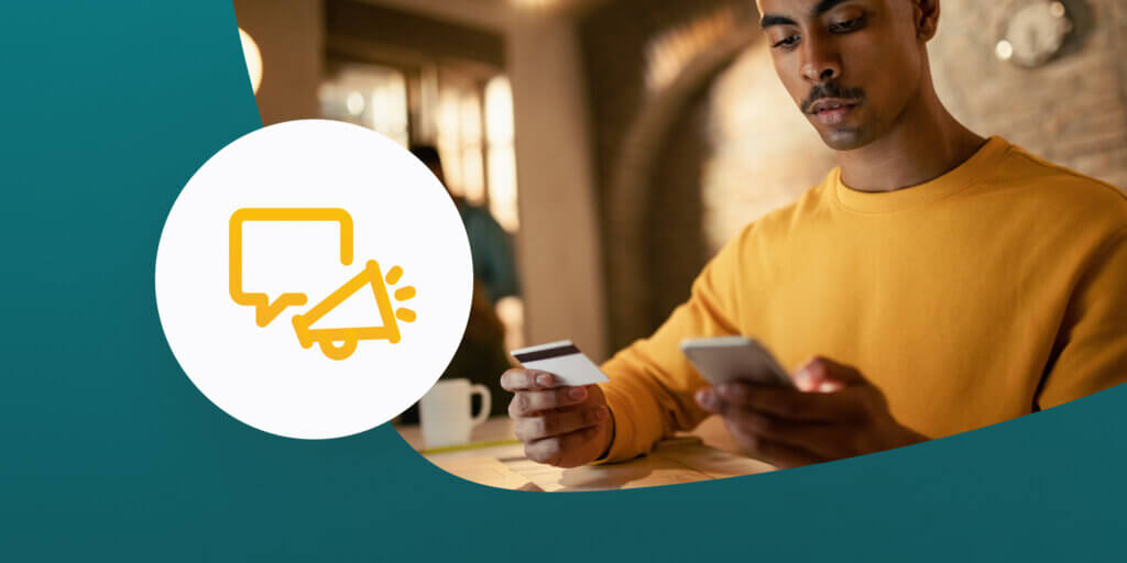 Graphic of a man completing a purchase on his mobile phone, with an icon showing a text bubble and a speaker to represent SMS marketing